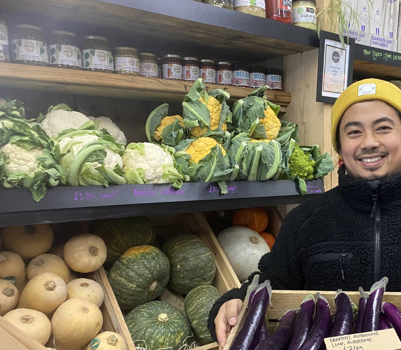 Shelves of cauliflower, romanesco and squash inside The Village Greengrocers
